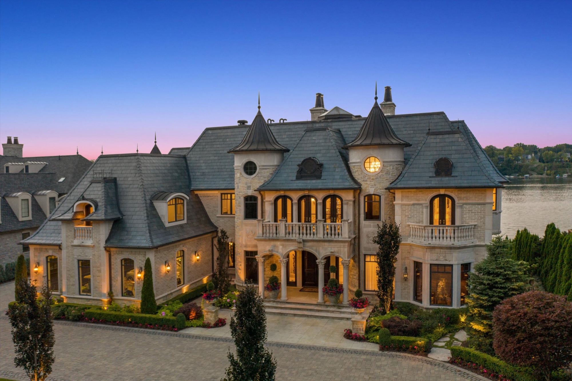 Custom lakefront estate at dusk